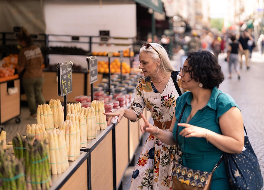 Looking at produce on a gourmet food tour in France