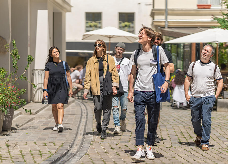 Following a guide down the street on the Marais neighbourhood tour