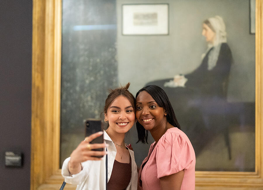 Taking a selfie in front of a painting at Musee d'Orsay