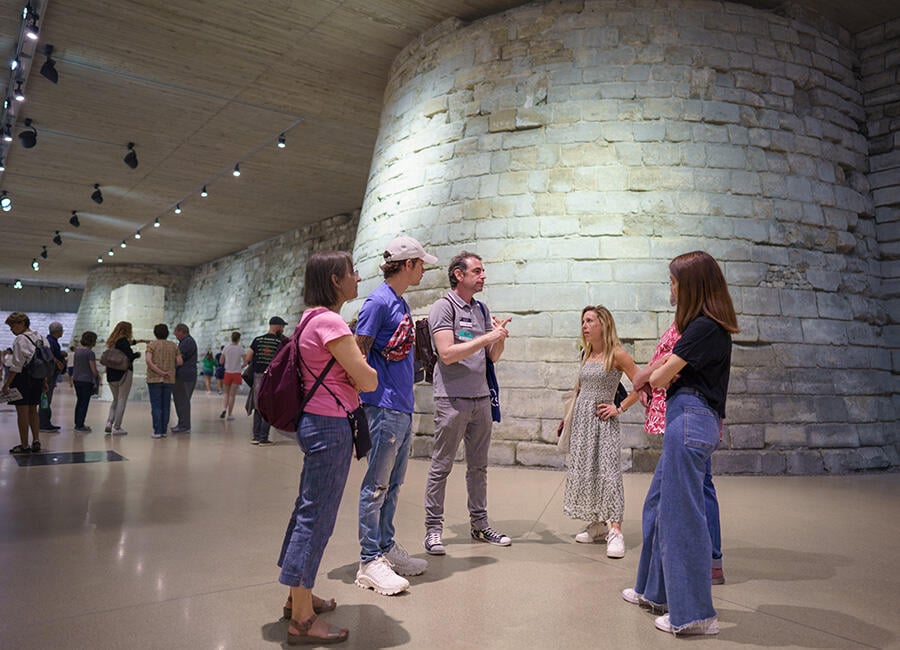 Talking in a group in the Louvre