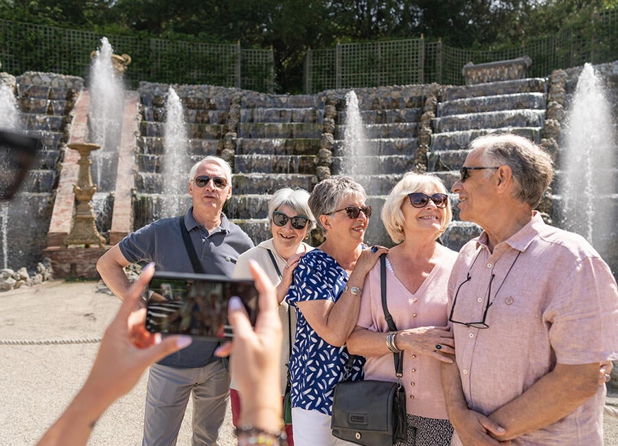 Taking a group photo in the garden at Versailles